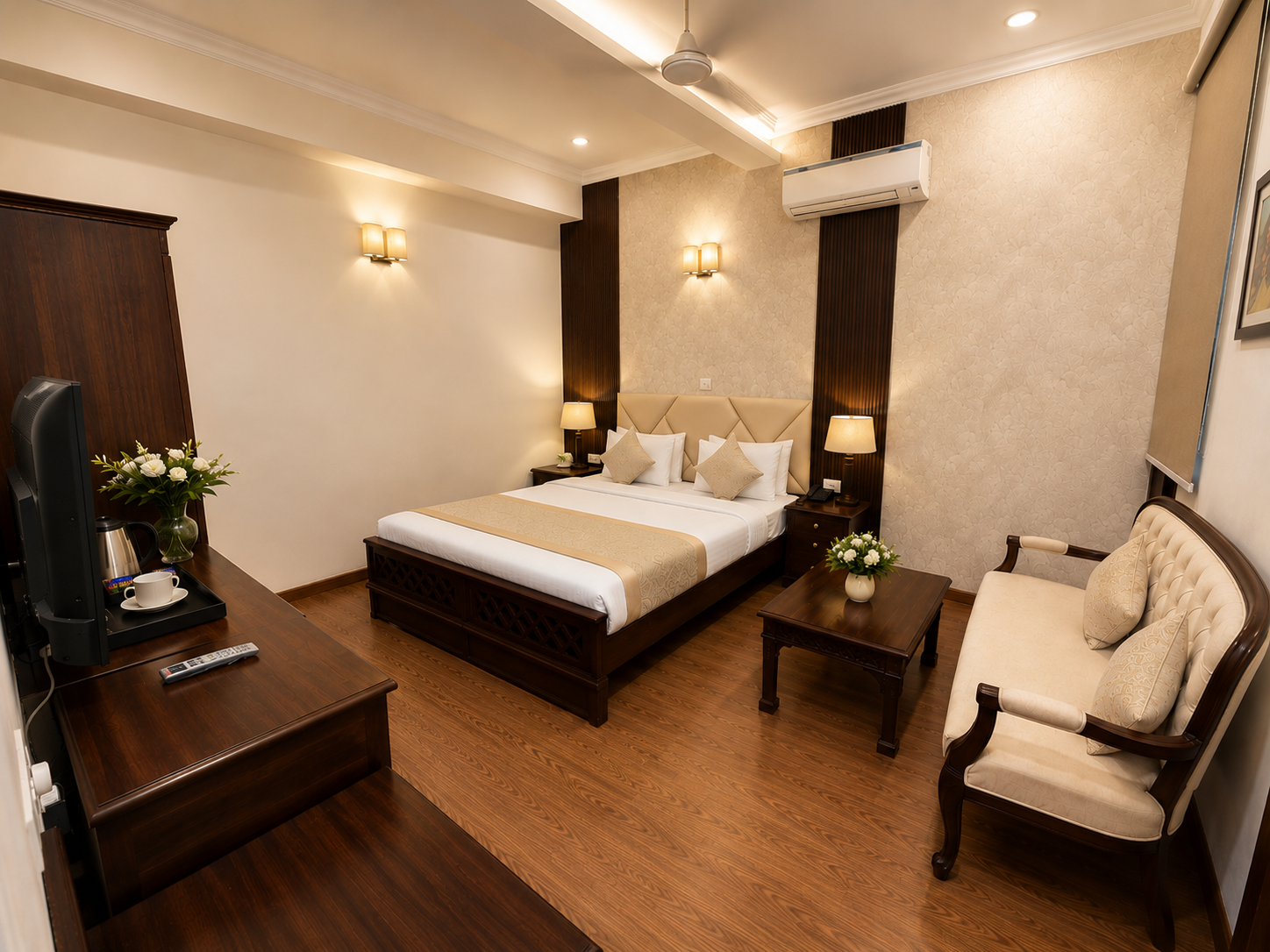 Hotel Ambica Palace — cozy king room with tea tray and lounge chair