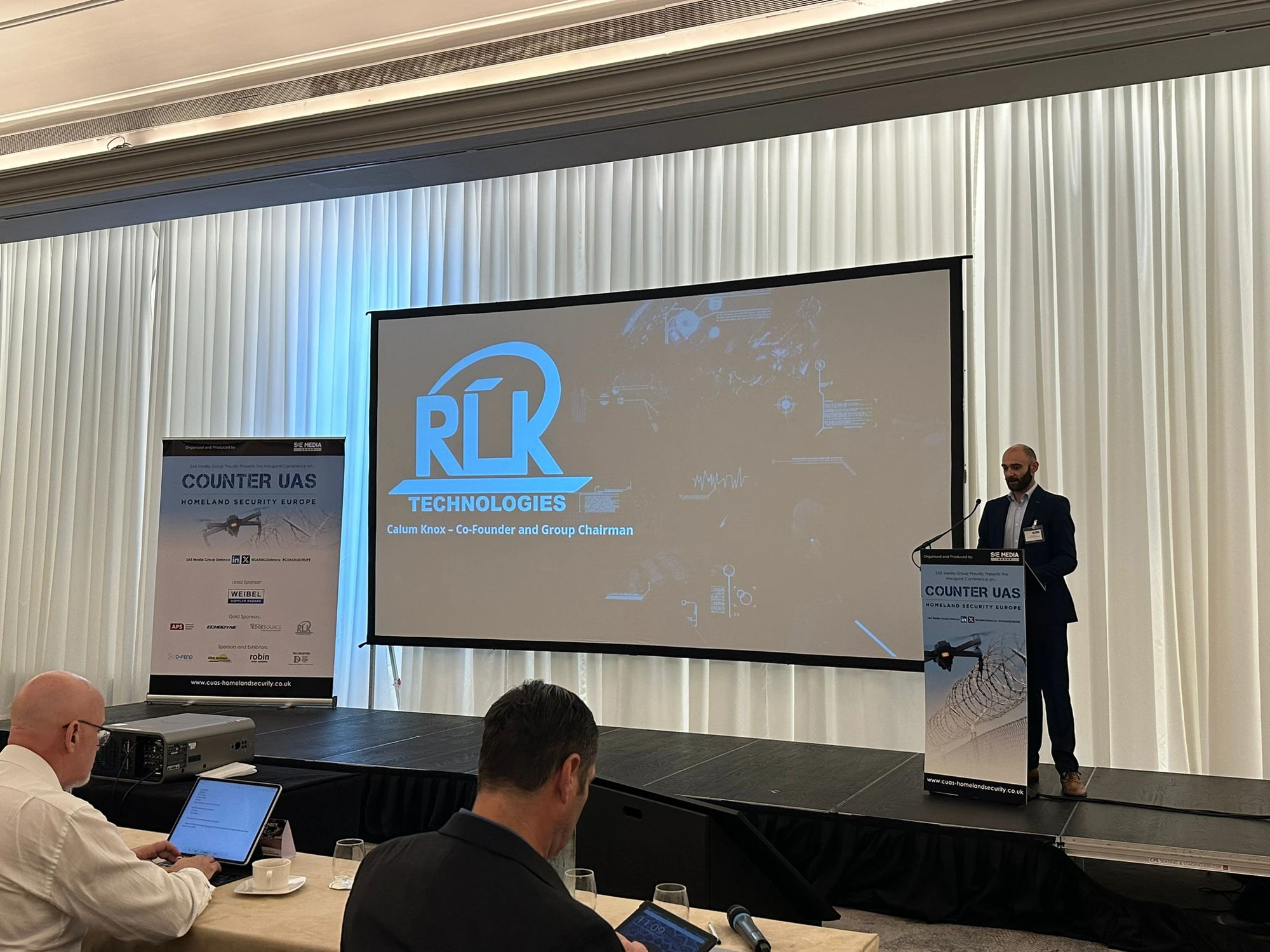 Calum Knox speaking at the Counter UAS Homeland Security Europe conference, presenting RLK Technologies