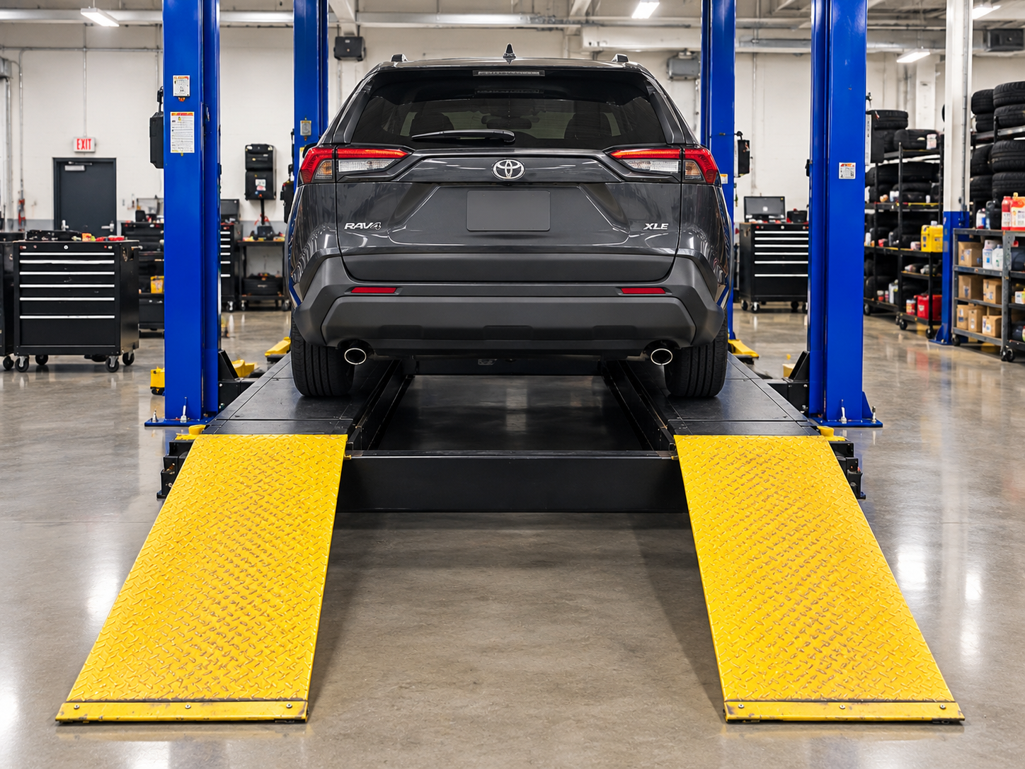 A Toyota RAV4 on the lift at His Grace Auto Repair