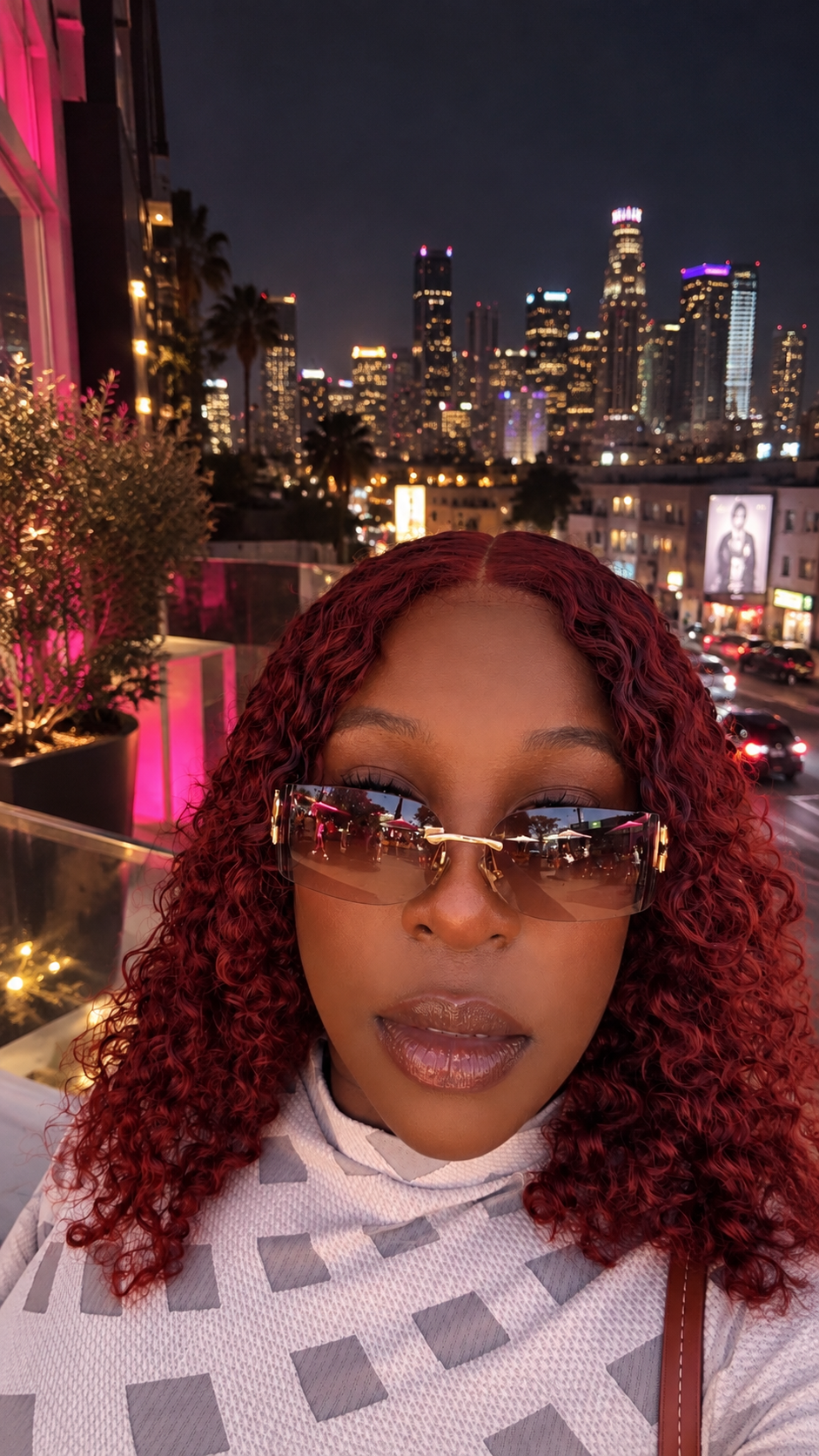 Morgan Chanel against the city skyline at night