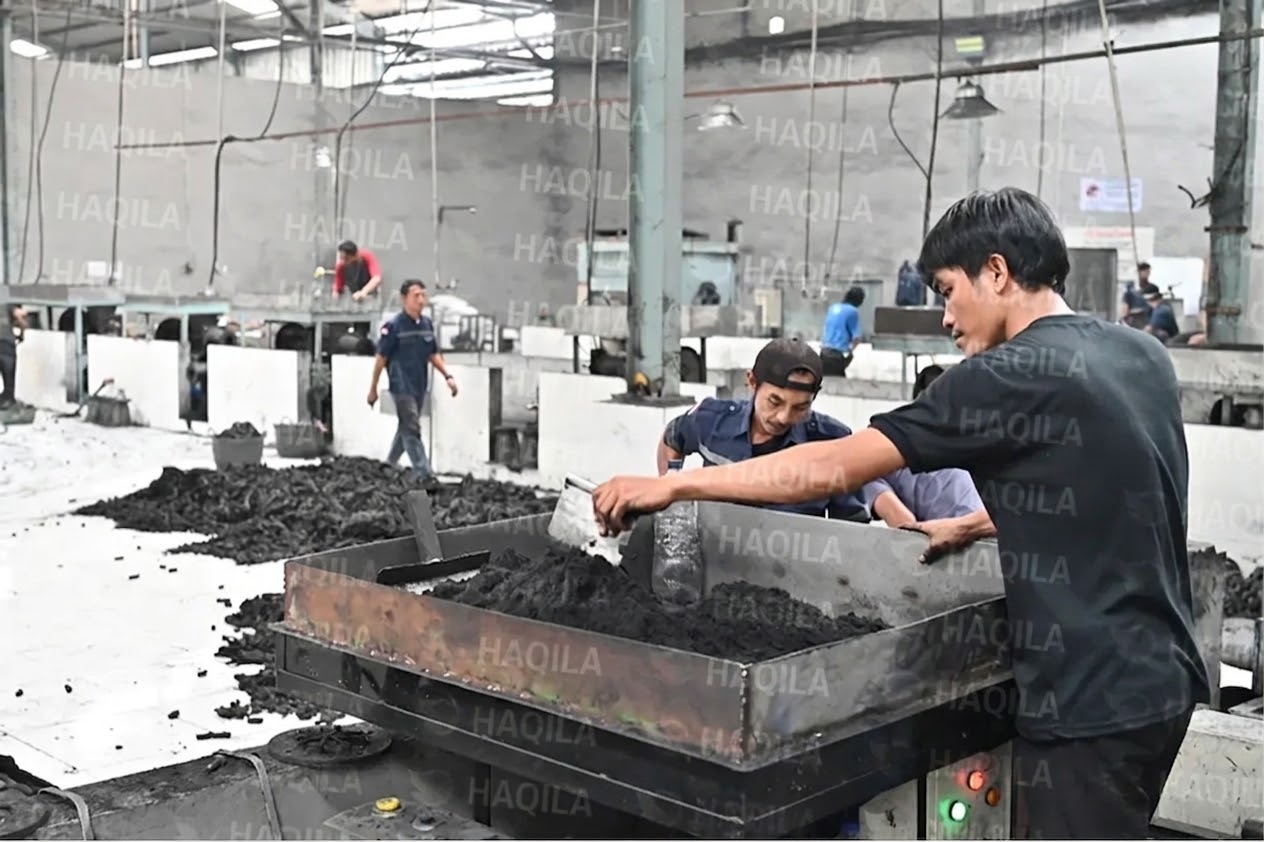 Charcoal paste being prepared and mixed at a manufacturing partner's facility