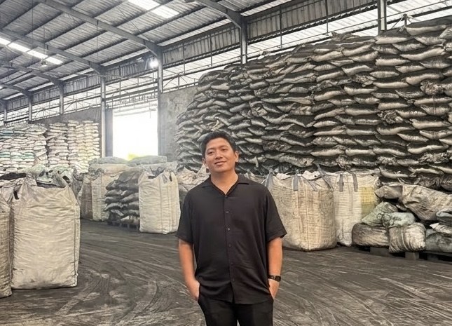 HAQILA founder at the coconut shell charcoal warehouse in Indonesia