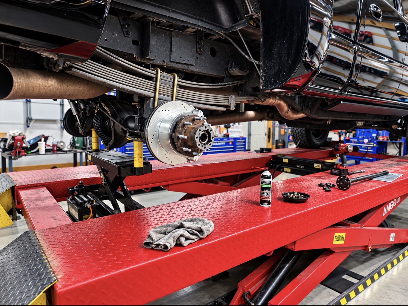 Truck on the lift with new drilled brake rotor