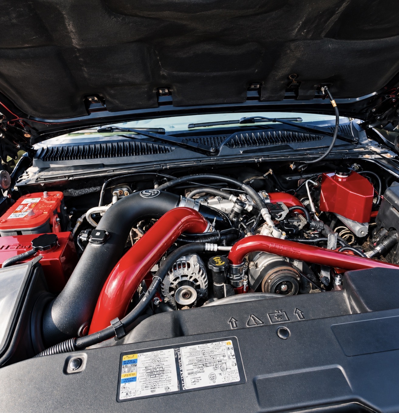Completed blacked-out engine bay with red accents