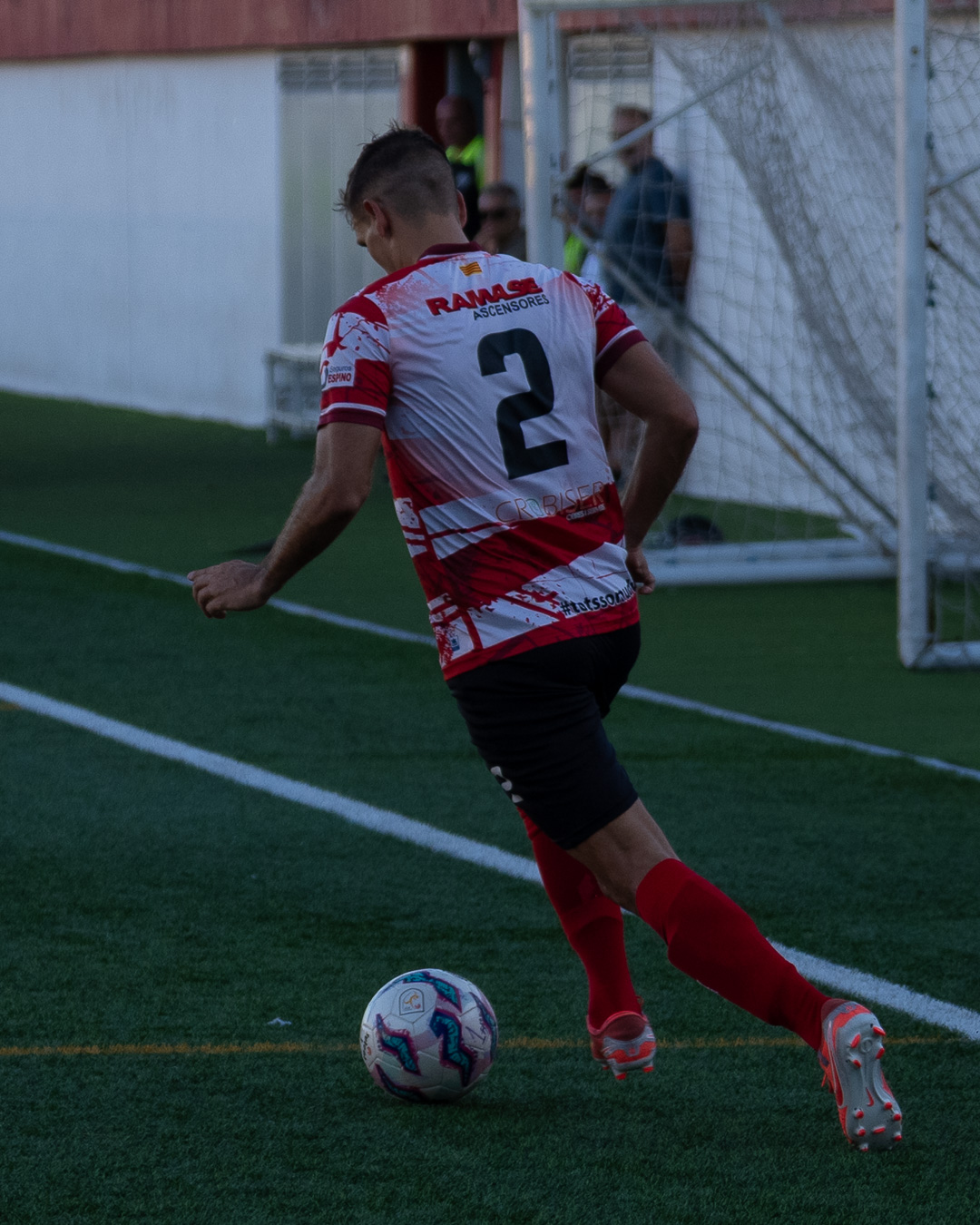 Right-back #2 pushing forward with the ball toward the box