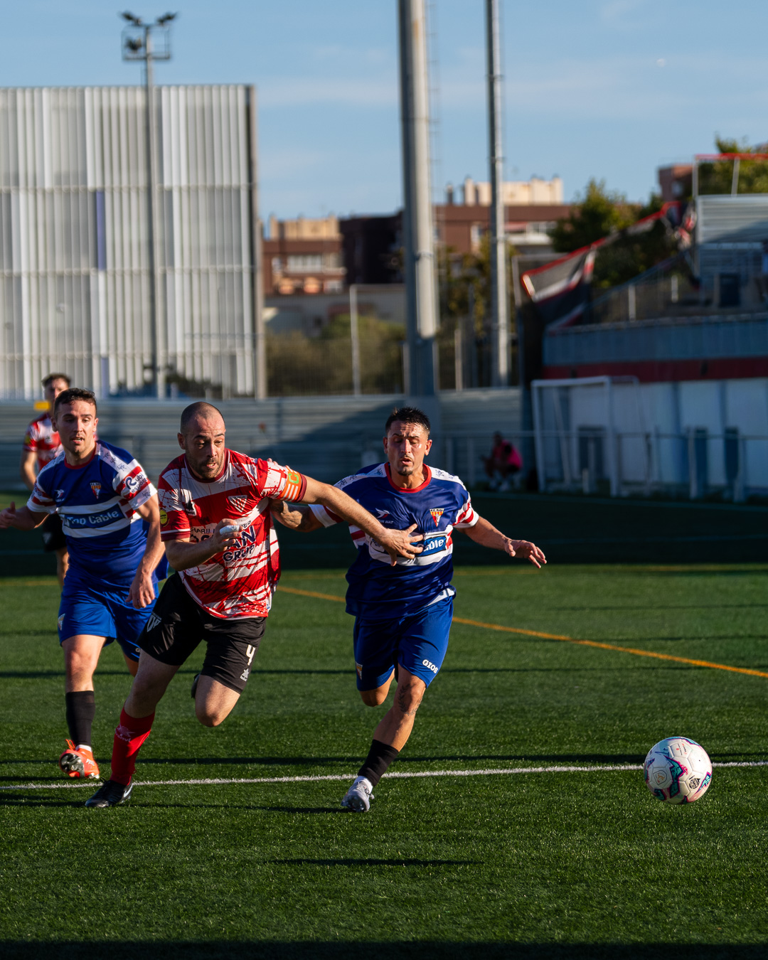 Aerial duel — holding off the defender to win the header