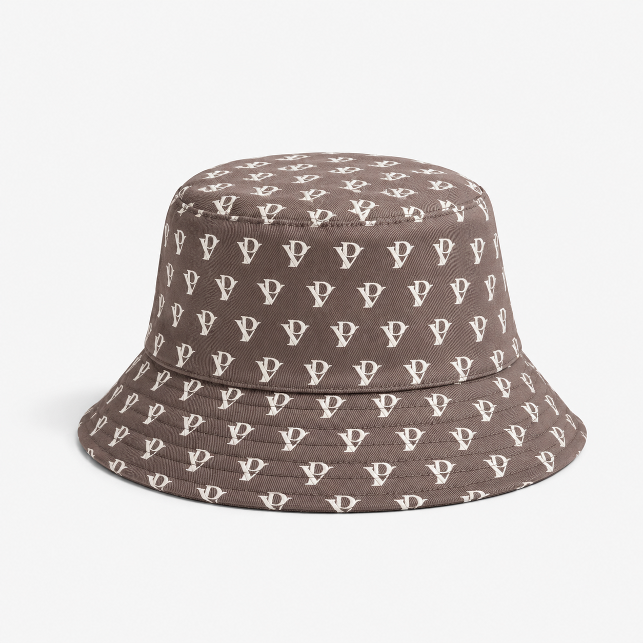 Monogram Reversible Bucket Hat — Taupe in Taupe — worn by a model