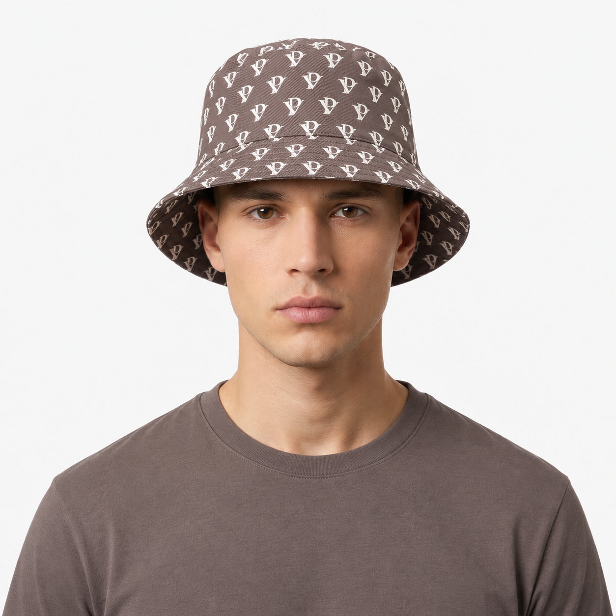 Monogram Reversible Bucket Hat — Taupe in Taupe — worn by a model